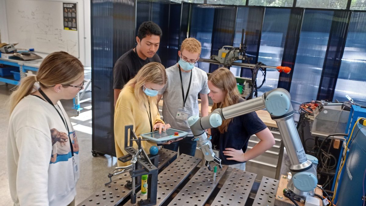 2023 Rotary Students Programming the Cobot.